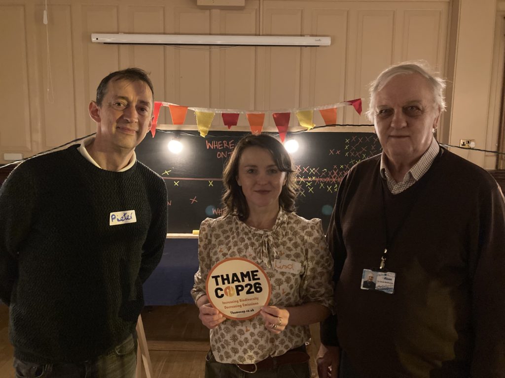 Photo of (left to right) Cllr Barker, Lisa Meaney and Cllr Bretherton at a Thame COP26 event. Lisa is holding the Thame COP26 logo sticker.
