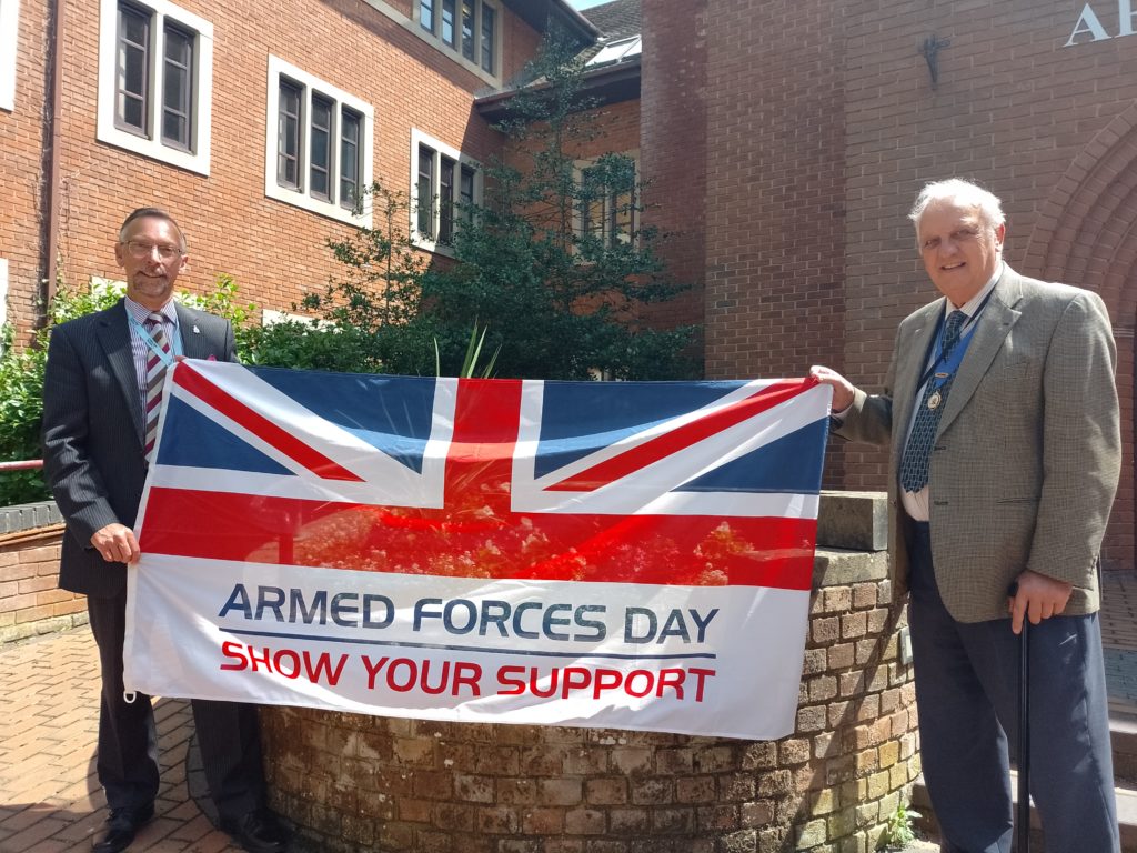 Cllr David Bretherton (R), Armed Forces and Veterans’ Champion at South Oxfordshire District Council and Cllr Mark Coleman (L), Armed Forces and Veterans’ Champion at Vale of White Horse District Council, outside Abbey House in Abingdon holding the Armed Forces Day Flag.